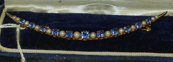 Gold crescent brooch